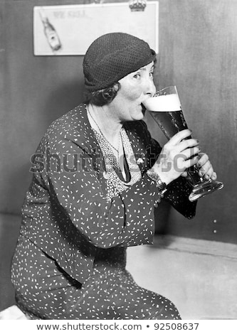 woman-drinking-out-big-beer-450w-92508637.jpg
